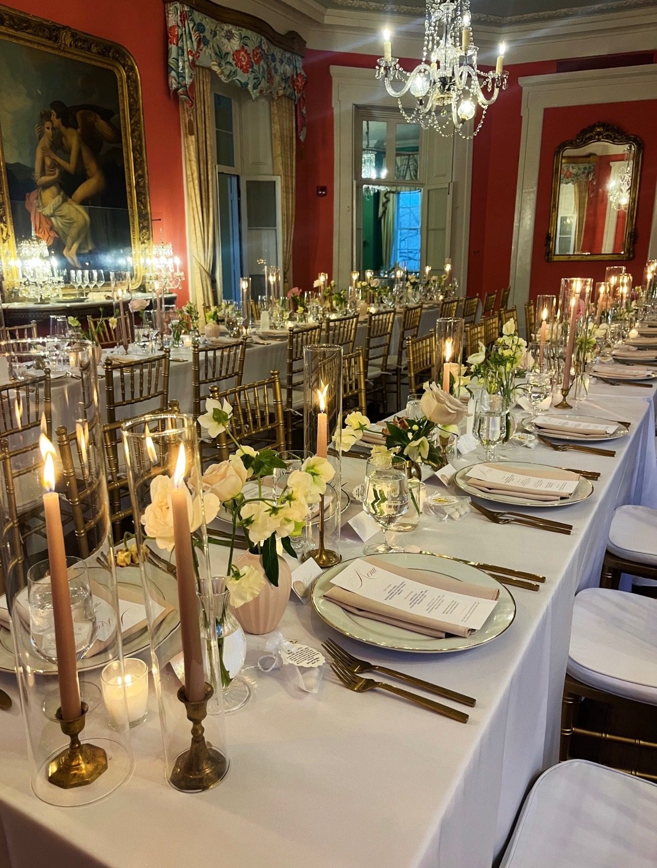 Candlelit reception table with blush taper candles and garden roses